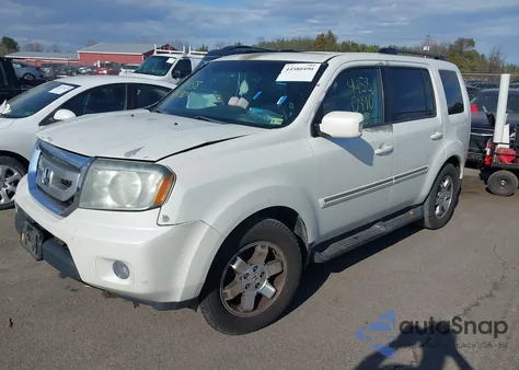 2011 Honda Pilot Touring z USA, uszkodzony, nr VIN 5FNYF4H97BB065766